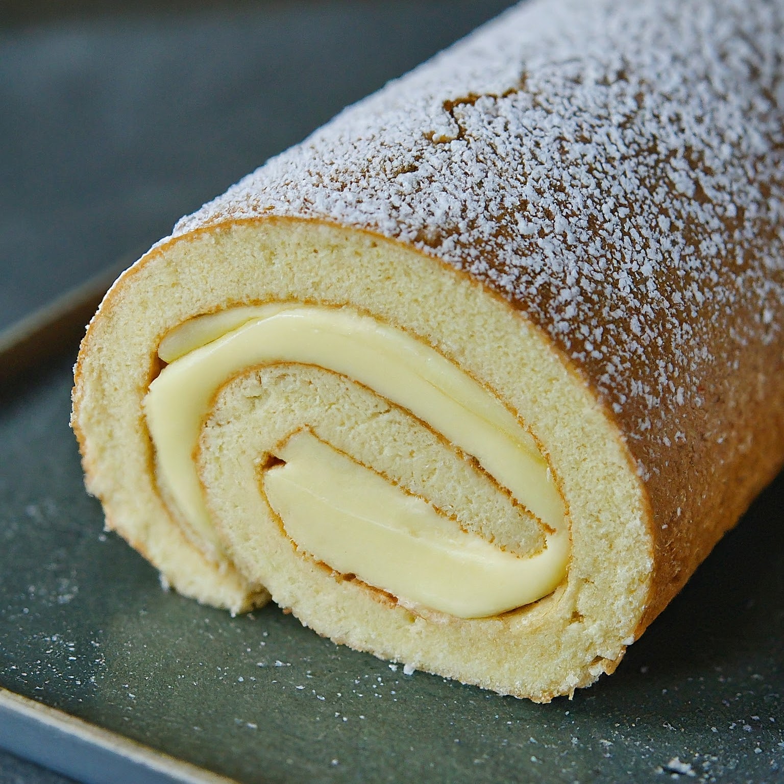 Mary berry white chocolate roulade is a delicious dessert that features a light and fluffy sponge cake rolled around a creamy filling made with melted white chocolate, whipped cream, and fresh raspberries.